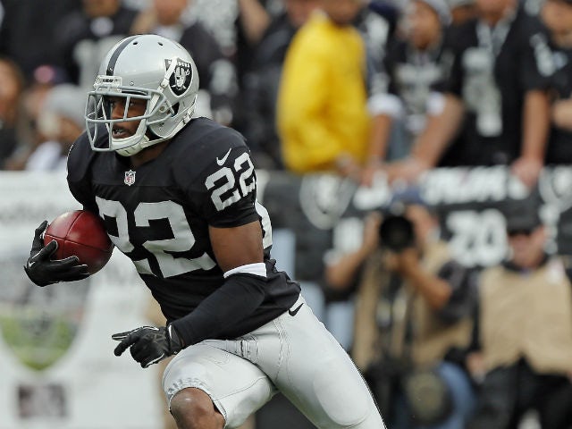 Taiwan Jones #22 of the Oakland Raiders returns the ball for 20 yards against the Philadelphia Eagles in the second quarter on November 3, 2013