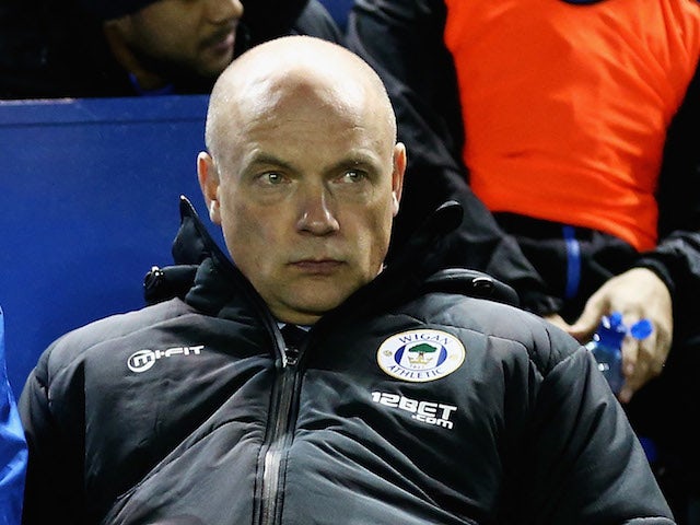 New manager of Wigan Athletic, Uwe Rosler, looks on during the Sky Bet Championship match between Sheffield Wednesday and Wigan Athletic at Hillsborough Stadium on December 18, 2013