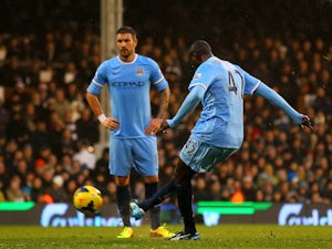 Yaya Toure of Manchester City scores the first goal from a freekick during the Barclays Premier League match against Fulham on December 21, 2013