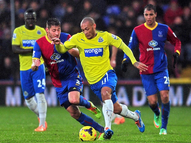 Newcastle United's French striker Yoan Gouffran vies for the ball with Crystal Palace's English defender Joel Ward during the English Premier League game on December 21, 2013