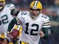 Quarterback Aaron Rodgers of the Green Bay Packers runs with the ball against the Chicago Bears during a game at Soldier Field on December 29, 2013 