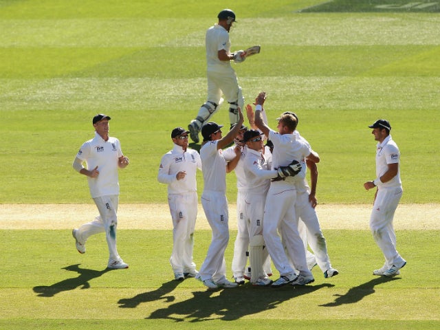 Stuart Broad of England celebrates with team mates after taking the wicket of Ryan Harris of Australia during day two of the Fourth Ashes Test Match between Australia and England at Melbourne Cricket Ground on December 27, 2013