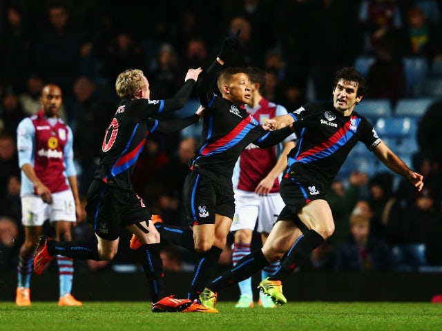Dwight Gayle of Crystal Palace celebrates with team mates after scoring the winning goal during the Barclays Premier League match between Aston Villa and Crystal Palace at Villa Park on December 26, 2013