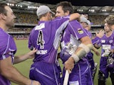 Ben Hilfenhaus of the Hurricanes celebrates victory with team mates during the Big Bash League match between Brisbane Heat and the Hobart Hurricanes on December 28, 2013