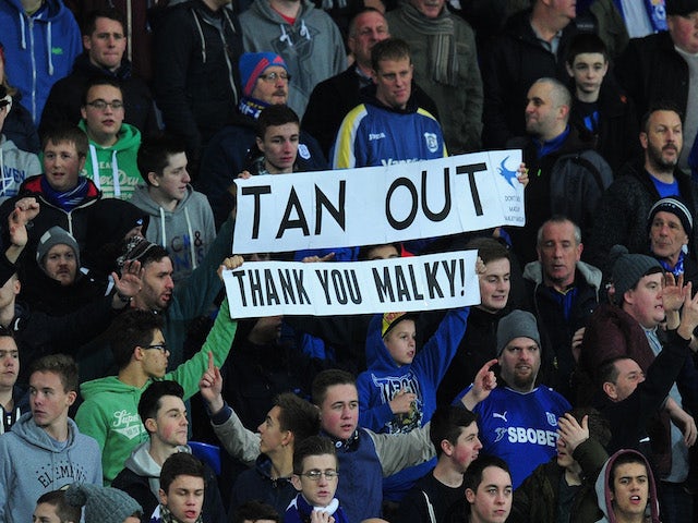 Cardiff fans show their support for former manager Malky MacKay during the Barclays Premier League match between Cardiff City and Sunderland on December 28, 2013