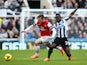 Newcastle's Cheick Tiote and Arsenal's Jack Wilshere battle for the ball during their Premier League match on December 29, 2013