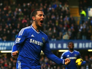 Eden Hazard of Chelsea celebrates scoring the first goal during the Barclays Premier League match between Chelsea and Swansea City at Stamford Bridge on December 26, 2013