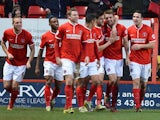 Charlton's Dale Stephens celebrates with teammates after scoring the opening goal against Sheffield Wednesday during their Championship match on December 29, 2013