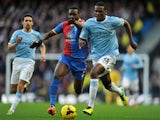 Dedryck Boyata of Manchester City competes with Yannick Bolasie of Crystal Palace during the Barclays Premier League match on December 28, 2013