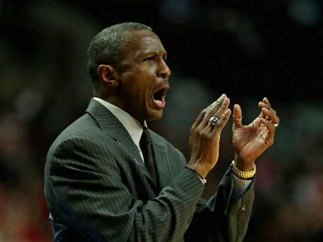 Head coach Dwane Casey of the Toronto Raptors encourages his team against the Chicago Bulls at the United Center on December 14, 2013