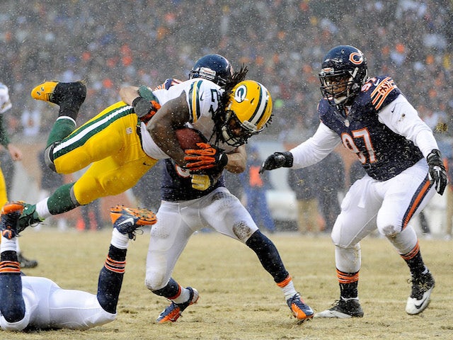 Running back Eddie Lacy of the Green Bay Packers carries the ball in the first quarter against the Chicago Bears during a game at Soldier Field on December 29, 2013