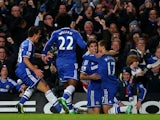 Chelsea's Eden Hazard celebrates with teammates after scoring his team's opening goal against Liverpool during their Premier League match on December 29, 2013 
