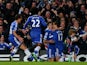 Chelsea's Eden Hazard celebrates with teammates after scoring his team's opening goal against Liverpool during their Premier League match on December 29, 2013 