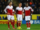 Pajtim Kasami, Steve Sidwell and Hugo Rodallega of Fulham prepare to restart the game after conceding a goal during the Barclays Premier League match on December 28, 2013