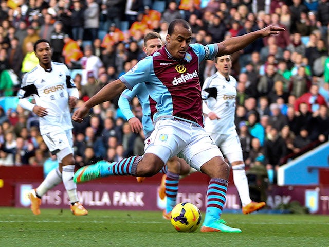 Gabby Agbonlahor of Aston Villa scores the opening goal of the game during the Barclays Premier League match against Swansea on December 28, 2013