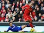 Glen Johnson of Liverpool is tackled by Craig Noone of Cardiff City during the Barclays Premier League match between Liverpool and Cardiff City at Anfield on December 21, 2013