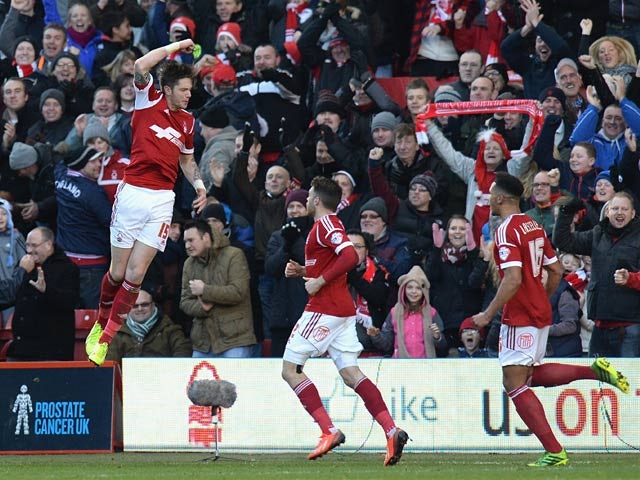 Forest's Greg Halford celebrates with teammates after scoring the opening goal against Leeds during their Championship match on December 29, 2013