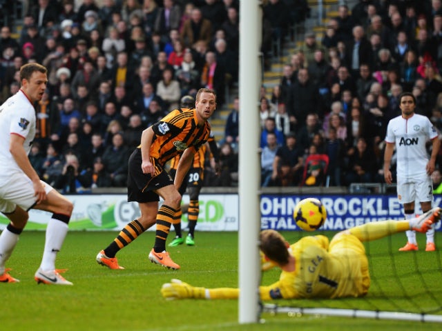 David Meyler of Hull City slots the ball past David De Gea the Manchester United goalkeeper to score his sides second goal during the Barclays Premier League match between Hull City and Manchester United at KC Stadium on December 26, 2013