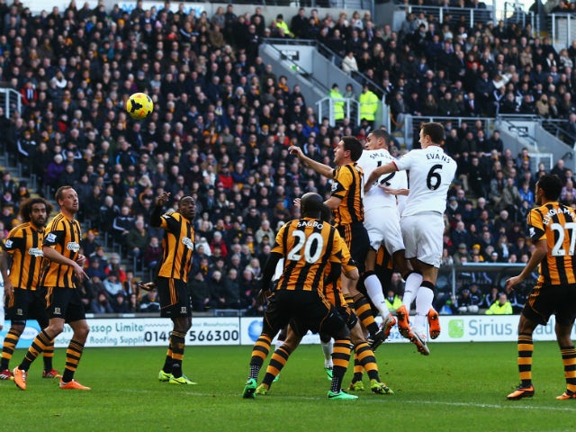 Chris Smalling of Manchester United scores his sides opening goal with a header during the Barclays Premier League match between Hull City and Manchester United at KC Stadium on December 26, 2013