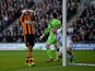James Chester of Hull scores an own goal in front of Wayne Rooney of Manchester United during the Barclays Premier League match between Hull City and Manchester United at KC Stadium on December 26, 2013