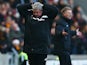 Hull City manager Steve Bruce and Manchester United manager David Moyes react on the touchline before the Barclays Premier League match between Hull City and Manchester United at KC Stadium on December 26, 2013