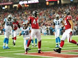 Jason Snelling of the Atlanta Falcons celebrates after scoring a first quarter touchdown against the Carolina Panthers at the Georgia Dome on December 29, 2013