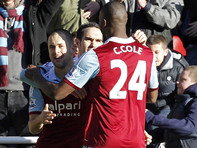 West Ham United's Joe Cole celebrates scoring the opening goal with Carlton Cole during the game with West Brom on December 28, 2013
