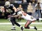 Lance Moore of the New Orleans Saints catches a touchdown pass over Leonard Johnson of the Tampa Bay Buccaneers at Mercedes-Benz Superdome on December 29, 2013