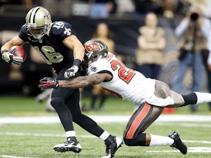 Lance Moore of the New Orleans Saints catches a touchdown pass over Leonard Johnson of the Tampa Bay Buccaneers at Mercedes-Benz Superdome on December 29, 2013