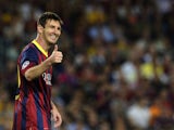 Barcelona forward Lionel Messi gives a thumbs up on September 18, 2013