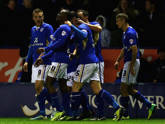 Leicester's Lloyd Dyer celebrates with teammates after scoring his team's fourth goal against Bolton during their Championship match on December 29, 2013