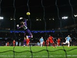 Alvaro Negredo of Manchester City shoots to score past Simon Mignolet of Liverpool during the Barclays Premier League match between Manchester City and Liverpool at Etihad Stadium on December 26, 2013