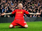 Liverpool's Martin Skrtel celebrates after scoring the opening goal against Chelsea during their Premier League match on December 29, 2013