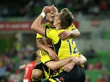 Stein Huysegems of the Phoenix celebrates with team-mate Tyler Boyd of the Phoenix after scoring a goal during the round 12 A-League match between Melbourne Heart and the Wellington Phoenix at AAMI Park on December 27, 2013