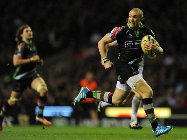 Mike Brown of Harlequins breaks away to score a try during the Aviva Premiership match between Harlequins and Exeter Chiefs at Twickenham Stadium on December 28, 2013