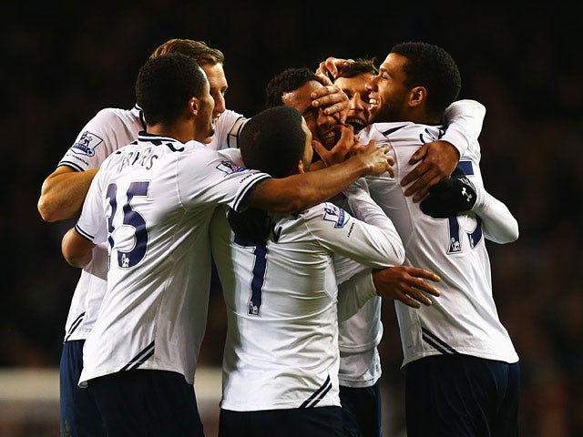 Tottenham's Mousa Dembele is mobbed by teammates after scoring the second goal against Stoke during their Premier League match on December 29, 2013