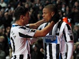 Newcastle United's French striker Loic Remy celebrates scoring their first goal with Newcastle United's French midfielder Hatem Ben Arfa during the English Premier League football match between Newcastle United and Stoke City at at St James' Park in Newca