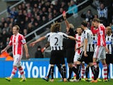 Stoke player Glenn Whelan is sent off by referee Martin Atkinson during the Barclays Premier League match between Newcastle United and Stoke City at St James' Park on December 26, 2013