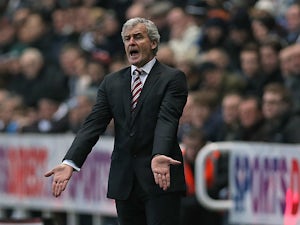 Stoke City's Welsh manager Mark Hughes gestures during the English Premier League football match between Newcastle United and Stoke City at St James' Park in Newcastle-upon-Tyne, northeast England on December 26, 2013