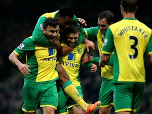Norwich hold on to edge out Cardiff