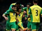 Norwich's Gary Hooper celebrates scoring the first goal of the game with team mates Robert Snodgrass, Leroy Fer and Johan Elmander during the Barclays Premier League match between Norwich City and Fulham at Carrow Road on December 26, 2013