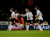 Scott Parker of Fulham celebrates with team mates as he scores their second goal during the Barclays Premier League match between Norwich City and Fulham at Carrow Road on December 26, 2013