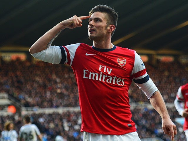 Arsenal's Olivier Giroud celebrates after scoring the opening goal against Newcastle during their Premier League match on December 29, 2013