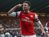 Arsenal's Olivier Giroud celebrates after scoring the opening goal against Newcastle during their Premier League match on December 29, 2013