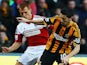 Robert Koren of Hull City holds off the challenge of Steve Sidwell of Fulham during the Barclays Premier League match on December 28, 2013