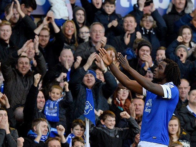 Everton's Romelu Lukaku celebrates in front of fans after scoring his team's second goal against Southampton during their Premier League match on December 29, 2013