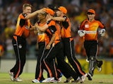 Alfonso Thomas of the Scorchers is congratulated by team mates after winning the Big Bash League match between the Perth Scorchers and the Melbourne Renegades at WACA on December 26, 2013