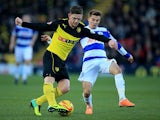 Watford's Sean Murray and QPR's Tom Carroll in action during their Championship match on December 29, 2013
