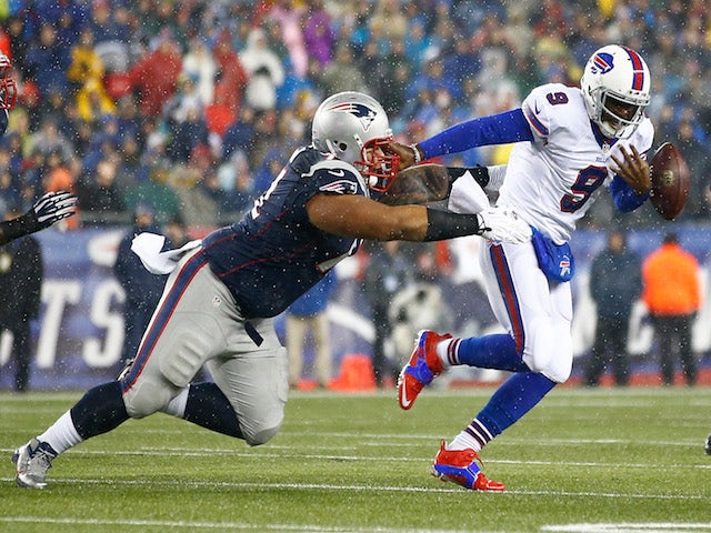 Thad Lewis #9 of the Buffalo Bills fumbles the ball while being ran down by Sealver Siliga #71 of the New England Patriots on December 29, 2013