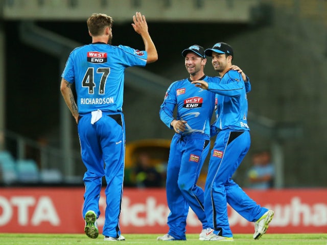 Callum Ferguson of the Strikers celebrates with team mates after running out Kurtis Patterson of the Thunder during the Big Bash League match between Sydney Thunder and the Adelaide Strikers at ANZ Stadium on December 27, 2013